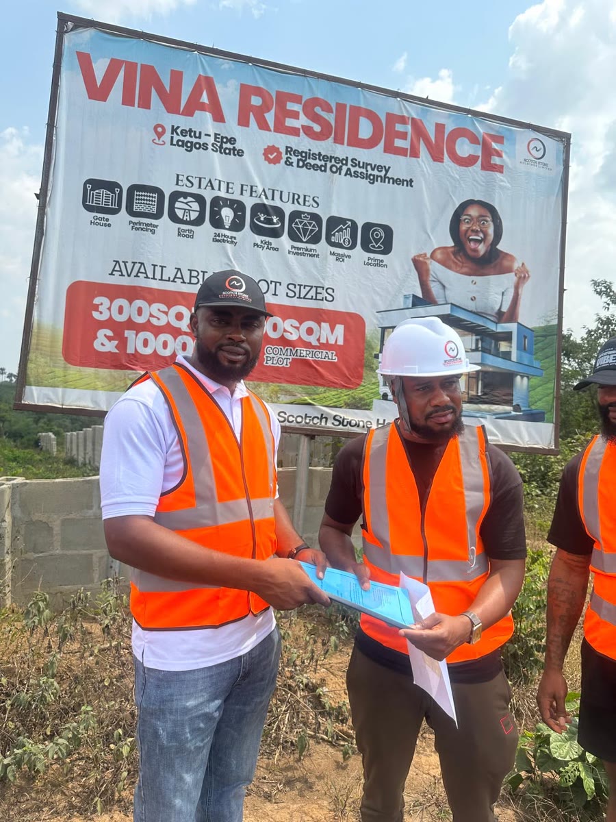 Two men reviewing an allocation document together on site