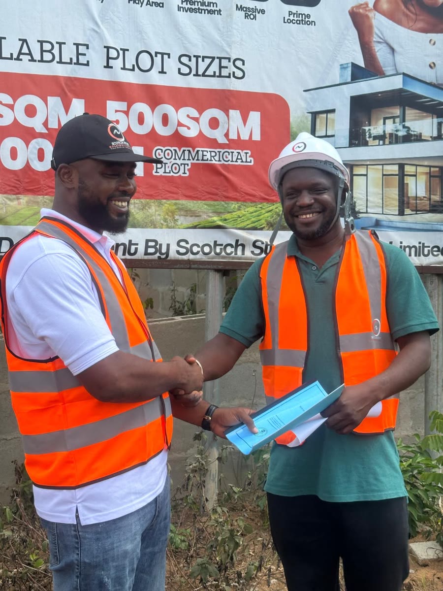 A buyer shaking hands after collecting his allocation file